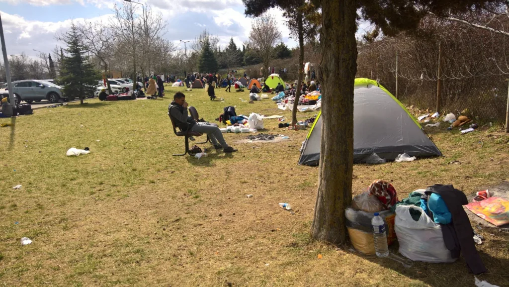 Migrants taking a moment to relax before their departure