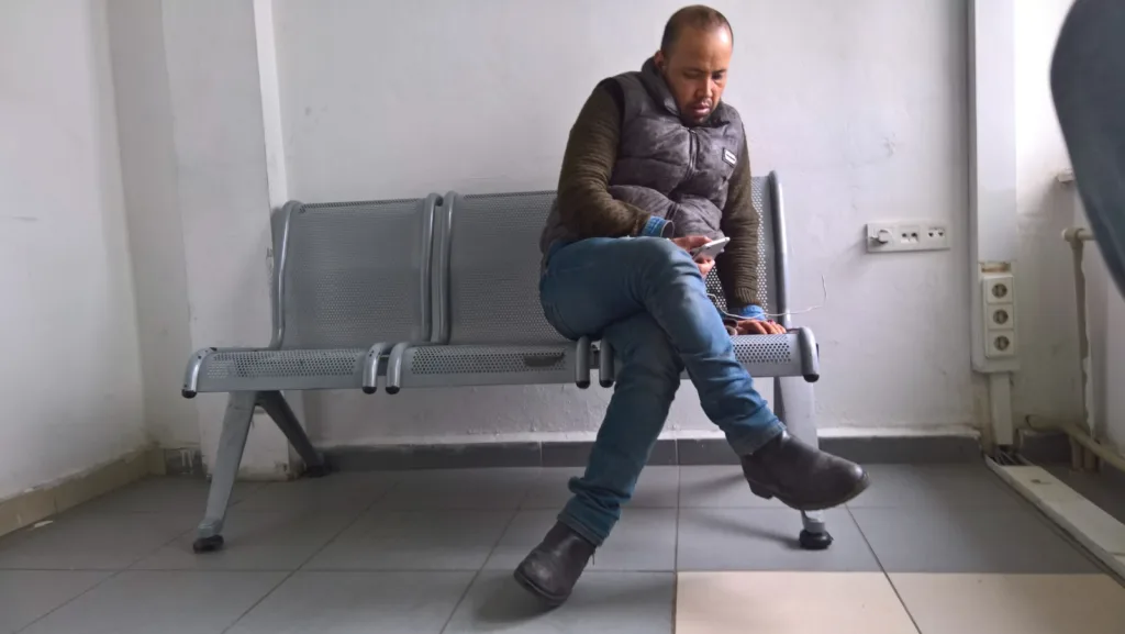 Injured migrant arrested after being hit by a gas can thrown by Greek police